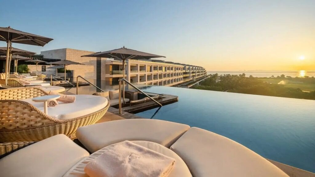 ATELIER Playa Mujeres resort pool and coastal view