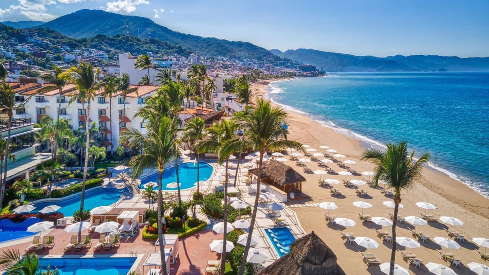 Buenaventura Grand beachfront resort in Puerto Vallarta with ocean, beach, palms, and mountain views