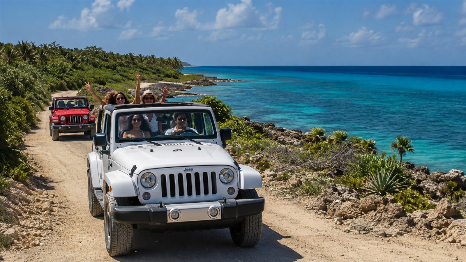 Visitors driving Jeeps on a coastal road in Cozumel